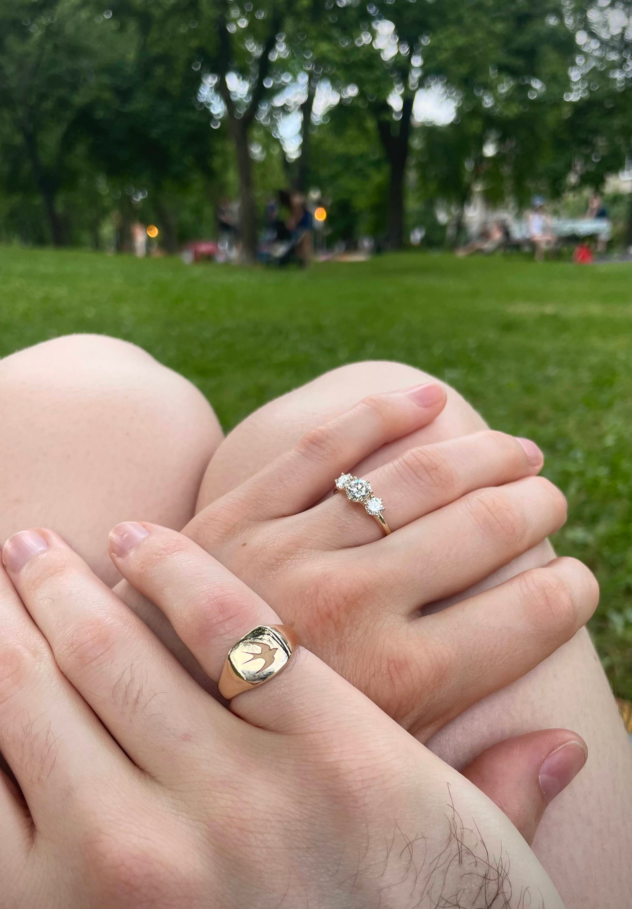 A close-up of the couple's rings